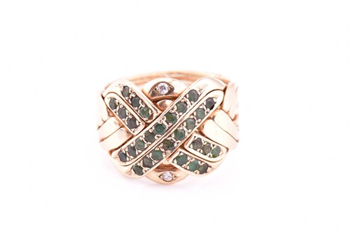 Lot 167 - A yellow gold and emerald knotwork dress ring...