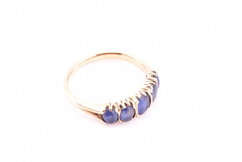 Lot 86 - A five stone sapphire ring, the graduated oval...
