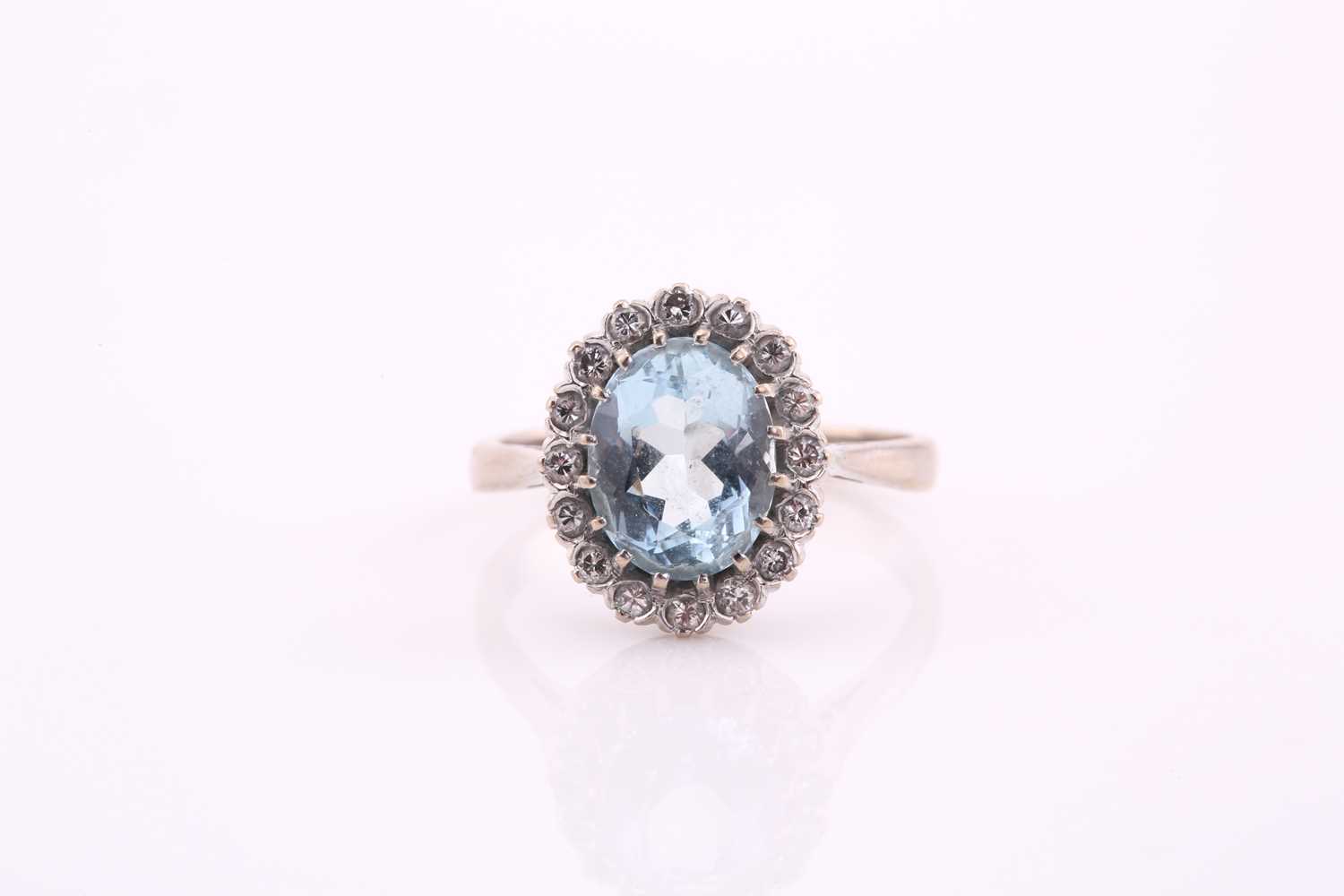 Lot 36 - An aquamarine and diamond cluster ring, the...