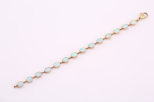 Lot 274 - A synthetic opal line bracelet, the fourteen...