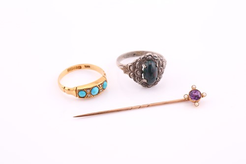 Lot 254 - Two rings and a stick pin, comprising of an...