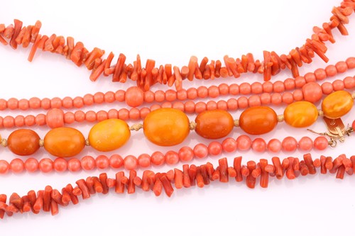 Lot 58 - A coral bead two strand necklace, the yellow...