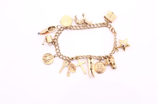 Lot 191 - A 9ct gold charm bracelet, consisting of a...