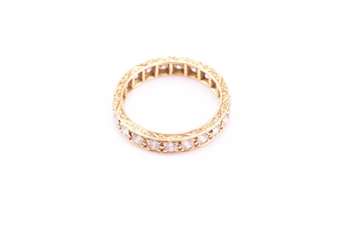 Lot 150 - An 18ct yellow gold and diamond eternity ring,...