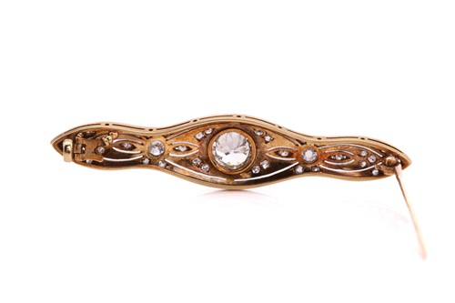 Lot 64 - A Belle Époque diamond bar brooch, comprises a...