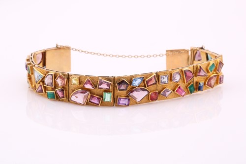 Lot 141 - A Modernist coloured gem-set bracelet,...