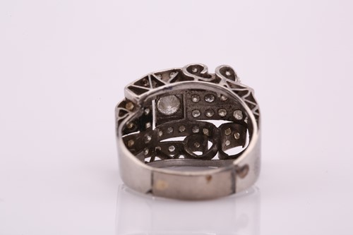 Lot 218 - A 1950s platinum and white gold dress ring,...