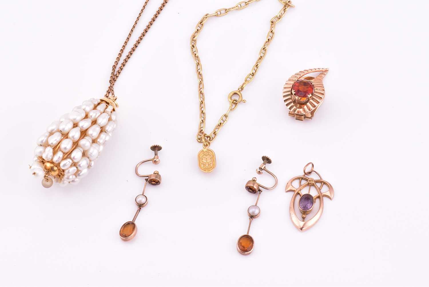 Lot 125 - A lot consists of miscellaneous pendants,...