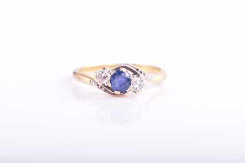 Lot 137 - A sapphire and diamond three stone cross over...