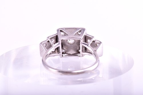 Lot 93 - An Art Deco style tiered diamond cluster ring;...