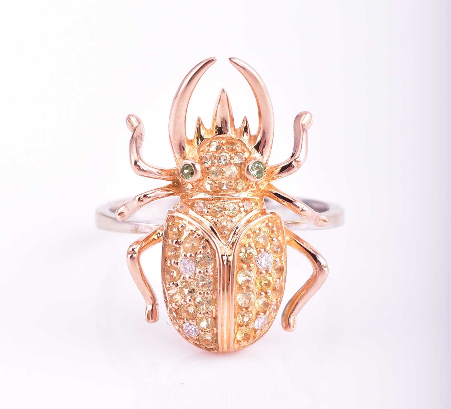 Lot 376 - A multi-gem set beetle ring; the 18 carat rose...