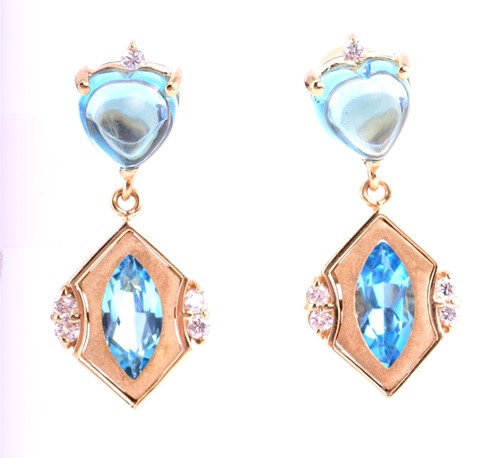 Lot 72 - A pair of blue topaz and diamond pendant...