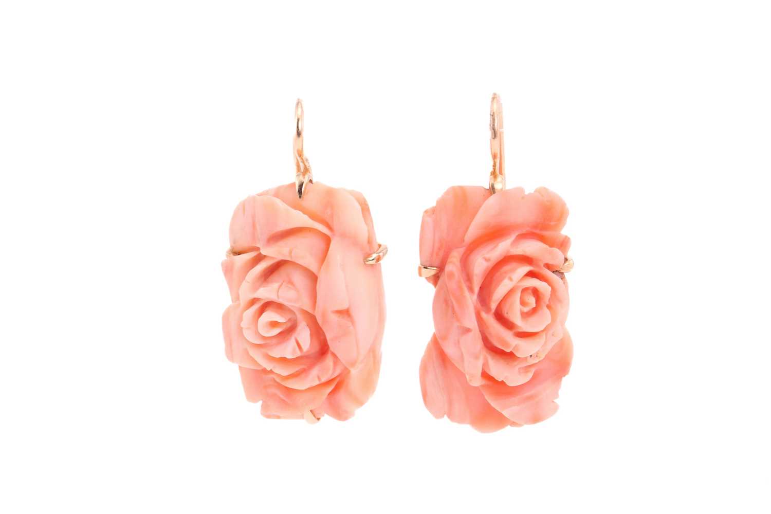 Lot 31 - A pair of coral pendant earrings; the carved...