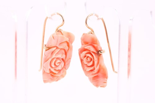 Lot 31 - A pair of coral pendant earrings; the carved...