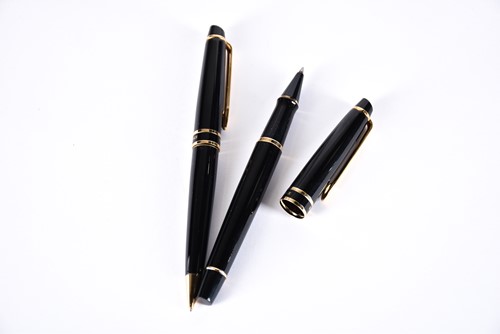 Lot 600 - A Waterman's black laquer rollerball pen with...