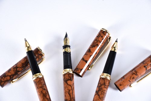 Lot 600 - A Waterman's black laquer rollerball pen with...