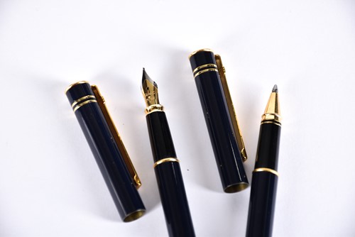 Lot 600 - A Waterman's black laquer rollerball pen with...