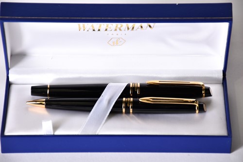 Lot 600 - A Waterman's black laquer rollerball pen with...