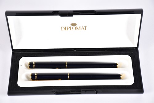 Lot 600 - A Waterman's black laquer rollerball pen with...