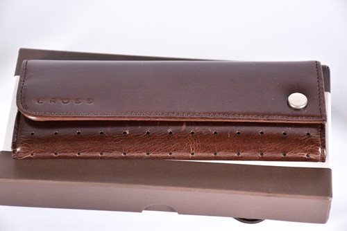 Lot 600 - A Waterman's black laquer rollerball pen with...