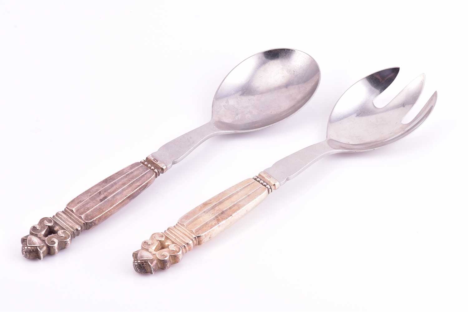 Lot 21 - A pair of Georg Jensen stainless steel and...