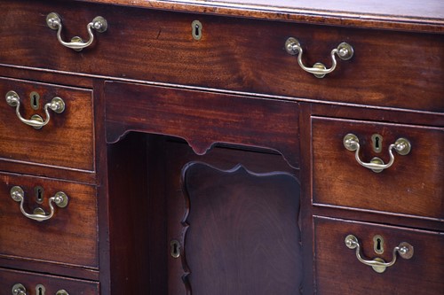 Lot 239 - A George III mahogany kneehole writing desk...