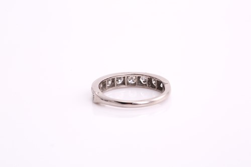 Lot 163 - An 18ct white gold diamond half eternity ring,...