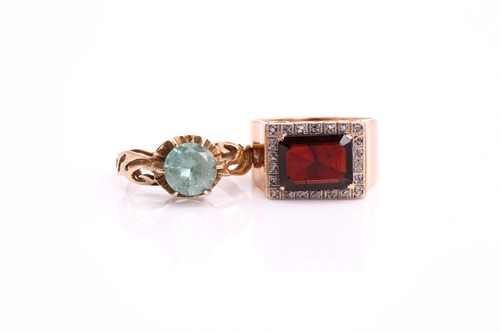 Lot 118 - A lot consists of a garnet halo ring and a...