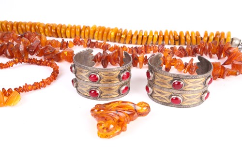 Lot 19 - A lot consists of three amber bead necklaces,...