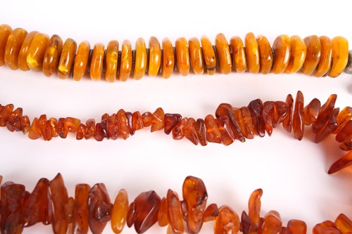 Lot 19 - A lot consists of three amber bead necklaces,...