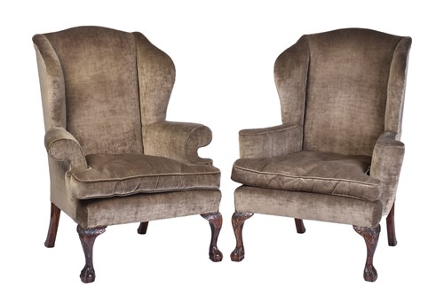 Lot 303 - Two similar George II style wing back fireside...