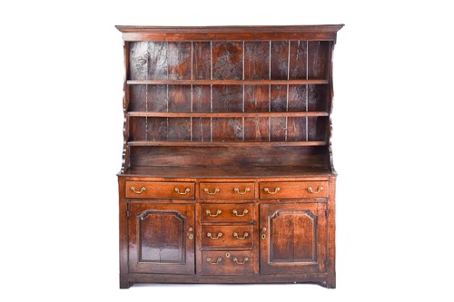 Lot 309 - A George III oak dresser and Delft rack fitted...