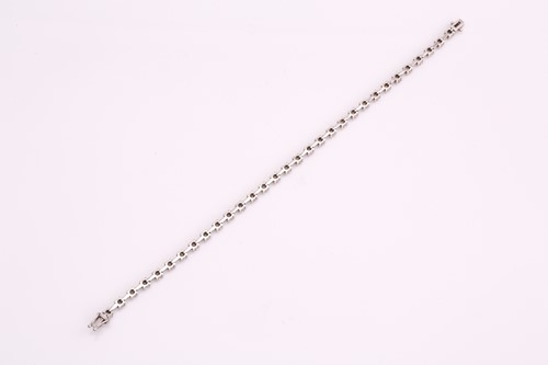 Lot 150 - A diamond tennis bracelet, consisting of 31...
