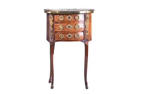 Lot 339 - A Louis XVI satinwood and tulipwood Table en...