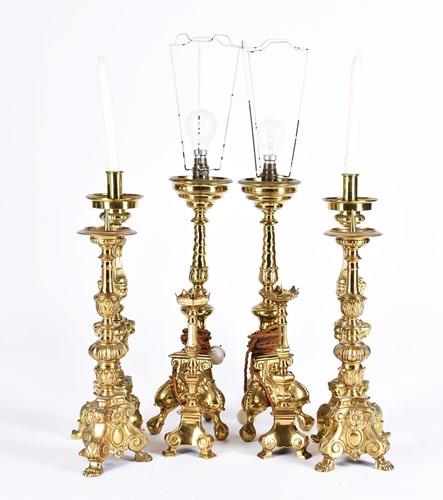 Lot 571 - Four pairs of rococo style Dutch brass pricket...