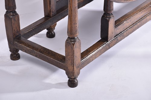 Lot 344 - An early 18th-century oak oval gateleg table...