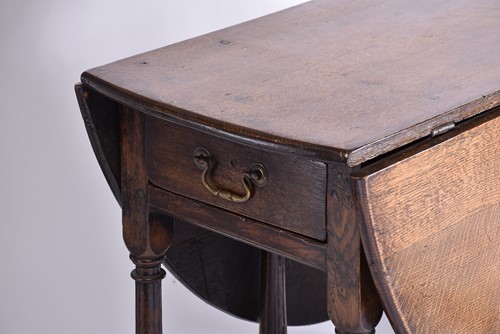 Lot 344 - An early 18th-century oak oval gateleg table...