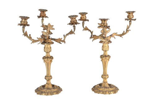 Lot 412 - A pair of gilt metal three branch candelabra,...