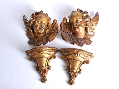 Lot 538 - A pair of gilt plaster cherub wall plaques...