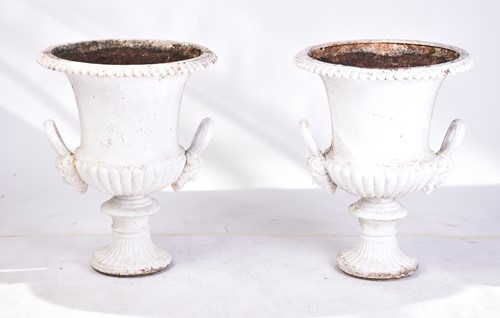 Lot 310 - A pair of cast iron two-handled campana urns...