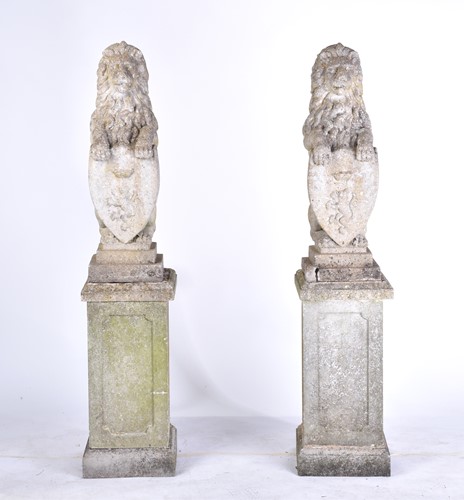 Lot 343 - A pair of cast stone figures of standing...