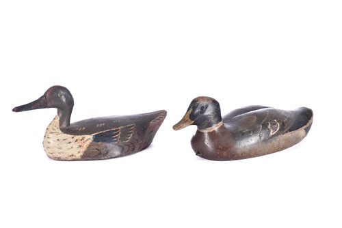 Lot 570 - Two hand carved and painted duck decoys, late...