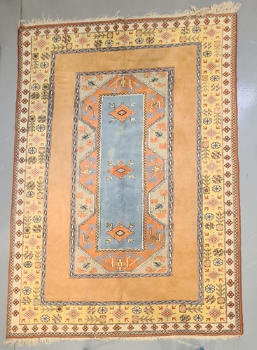 Lot 404 - A peach ground Turkish Milas carpet, 20th...