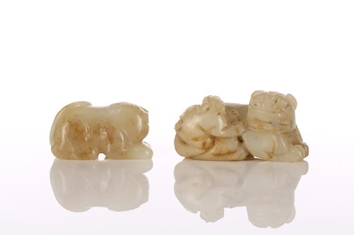 Lot 213 - A Chinese jade temple lion, in crouching...