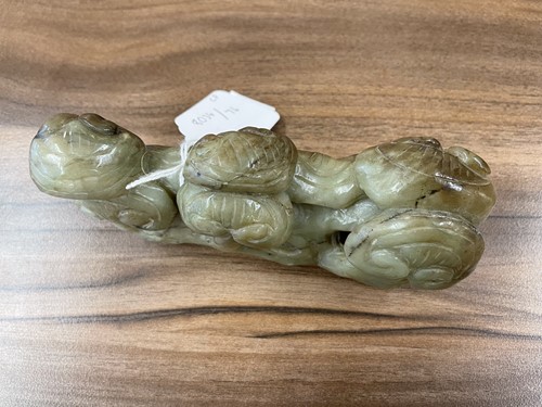 Lot 191 - A Chinese jade brush rest, 20th century,...
