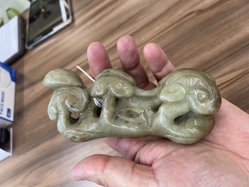 Lot 191 - A Chinese jade brush rest, 20th century,...