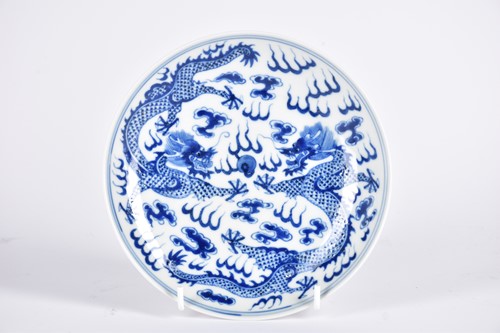 Lot 267 - A Chinese blue & white saucer dish, painted...