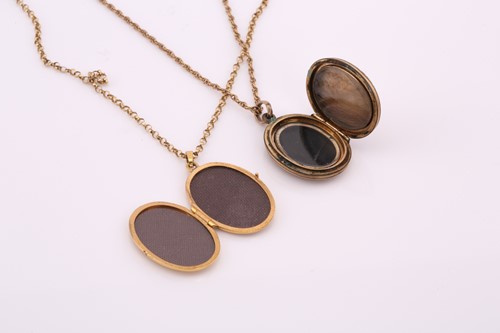 Lot 236 - Two locket necklaces, consisting of a 9ct gold...