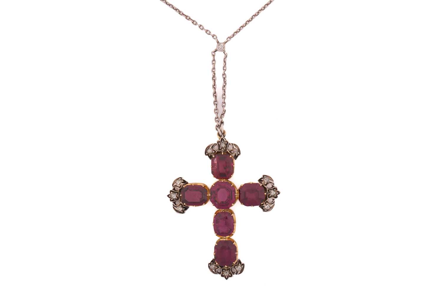 Lot 115 - A garnet and diamond cross pendant on chain,...