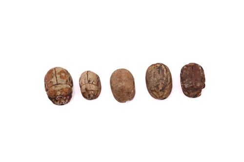 Lot 360 - A lot of five ancient Egyptian scarab beads,...